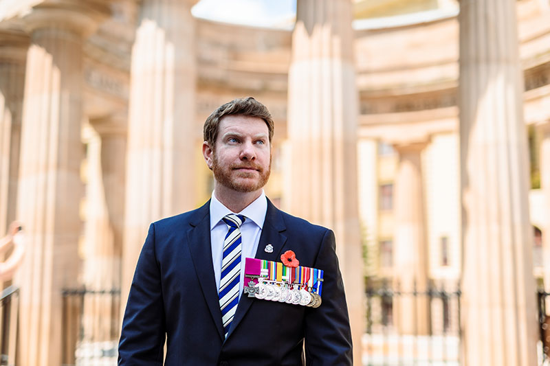 Daniel Keighran VC wearing a poppy on Remembrance Day 2022.