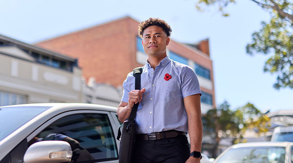 Man wearing a poppy for Remembrance Day